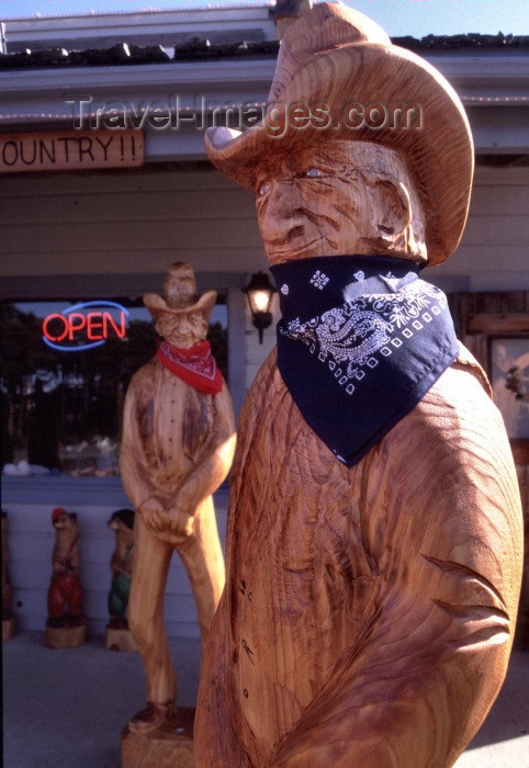 usa267: Newport (Oregon): wooden cowboys - photo by F.Rigaud - (c) Travel-Images.com - Stock Photography agency - Image Bank