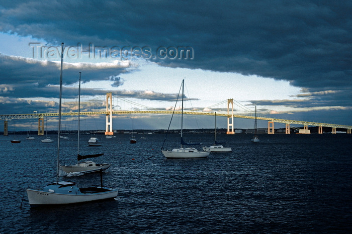 usa358: Narragansett Bay, Rhode Island, USA: boats and Claiborne Pell Newport Bridge, suspension bridge over the Atlantic Ocean - links Newport on Aquidneck Island and the Jamestown on Conanicut Island - stormy sky at sunset - photo by C.Lovell - (c) Travel-Images.com - Stock Photography agency - Image Bank