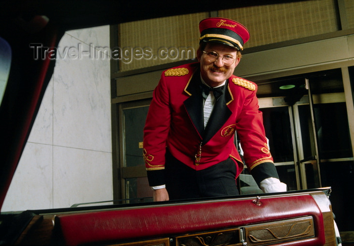 usa581: Dallas, Texas, USA: welcome to the Fairmont Hotel - doorman opens the car door - photo by C.Lovell - (c) Travel-Images.com - Stock Photography agency - Image Bank