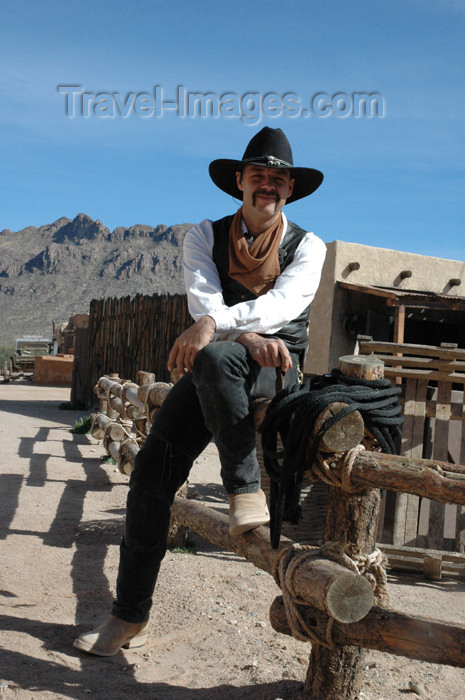 usa734: USA - Tombstone, Arizona - O.K. Corral film set - Old Tucson - Crooked Creek chapel - cowboy - sitting on the fence (photo by K.Osborn) - (c) Travel-Images.com - Stock Photography agency - Image Bank