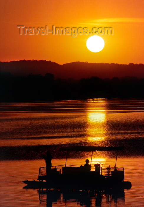 usa785: Mississippi, USA: Mississippi river at sunset - raft with pleasure boaters - photo by C.Lovell - (c) Travel-Images.com - Stock Photography agency - Image Bank