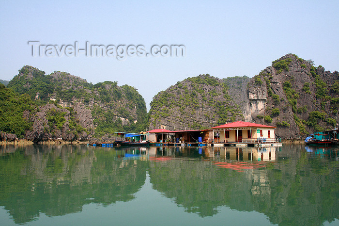 vietnam105: Halong Bay - Vietnam: floating village with limestone karsts reflected on the South China Sea - photo by Tran Thai - (c) Travel-Images.com - Stock Photography agency - Image Bank