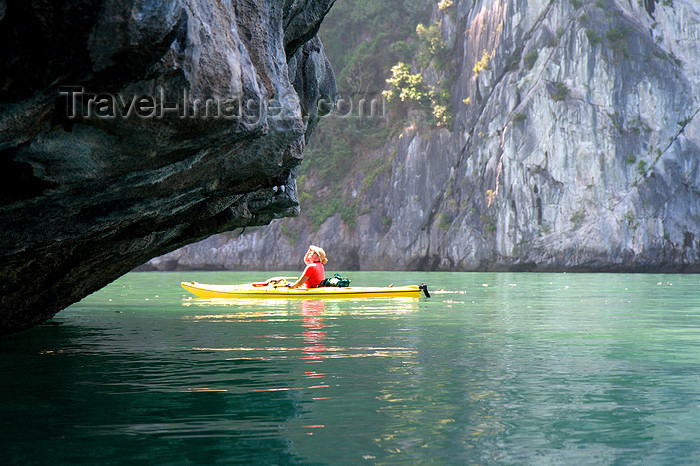 vietnam121: Halong Bay - Vietnam: woman kayaking - UNESCO World Heritage site - photo by Tran Thai - (c) Travel-Images.com - Stock Photography agency - Image Bank