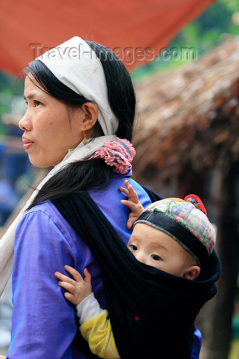 vietnam134: Ba Be National Park - Vietnam: woman with baby - the white headscarf tells that her husband is gone recently - photo by Tran Thai - (c) Travel-Images.com - Stock Photography agency - Image Bank