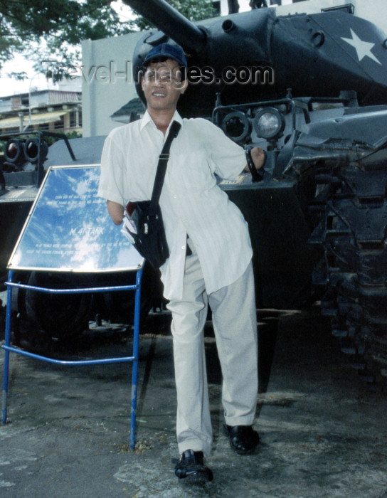 vietnam81: Vietnam - Ho Chi Minh city / Saigon: Quy stepped on a US landmine when he was nine years old - he lost both arms below the elbow, his right leg and an eye - War Remnants Museum (photo by Rod Eime) - (c) Travel-Images.com - Stock Photography agency - Image Bank