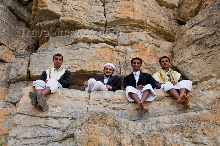 yemen109: Kohlan / Quhlan, Qohlan, Hajjah governorate, Yemen: local men gathered on rocks - cliff face - photo by J.Pemberton - (c) Travel-Images.com - Stock Photography agency - Image Bank