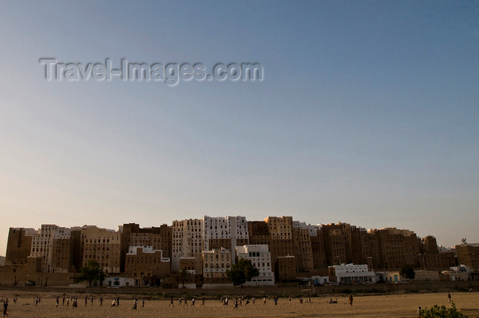 yemen61: Shibam, Hadhramaut Governorate, Yemen: locals playing soccer in front of Old town - photo by J.Pemberton - (c) Travel-Images.com - Stock Photography agency - Image Bank