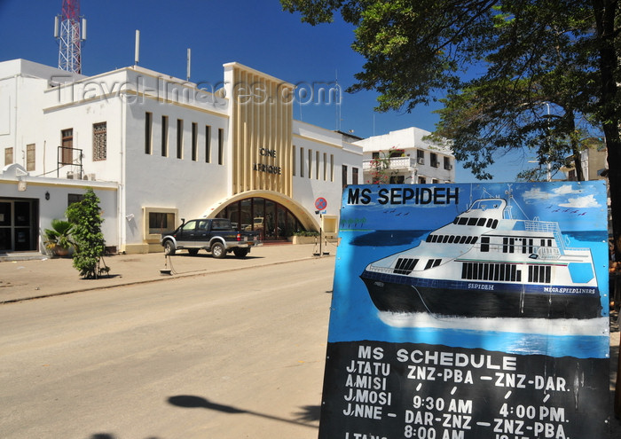 zanzibar127: Stone Town, Zanzibar, Tanzania: a ferry's schedule and Ciné Afrique - Malawi Road - Malindi area - photo by M.Torres - (c) Travel-Images.com - Stock Photography agency - Image Bank