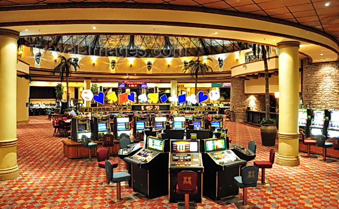 zimbabwe57: Victoria Falls, Matabeleland North, Zimbabwe: Kingdom Hotel Casino - The Kingdom At Victoria Falls - Casino area - slot machines room - photo by M.Torres - (c) Travel-Images.com - Stock Photography agency - Image Bank