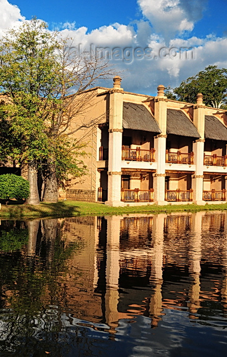 zimbabwe59: Victoria Falls, Matabeleland North, Zimbabwe: Kingdom Hotel - The Kingdom At Victoria Falls - pond side rooms - baobab trees - the architecture on the ancient Kingdom of Munhumutapa - photo by M.Torres - (c) Travel-Images.com - Stock Photography agency - Image Bank