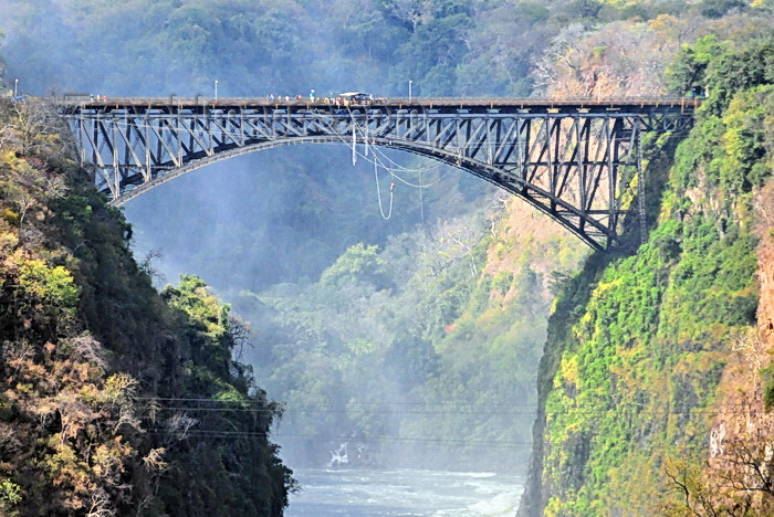 zimbabwe62: Victoria Falls, Matabeleland North, Zimbabwe: Victoria Falls Bridge aka Great Zambesi bridge - parabolic arch using a truss, braced spandrel type, designed by George Anthony Hobson and completed in 1905 - commissioned by Cecil John Rhodes in 1900 - used also for bungee jumping - photo by M.Torres - (c) Travel-Images.com - Stock Photography agency - Image Bank