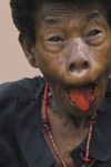 PNG - Papua New Guinea - Woman Grimacing, beetlenut stained tongue, KitavaIsland (photo by B.Cain)