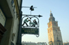 Poland - Krakow: restaurant sign and Town Hall tower (photo by M.Gunselman)