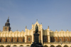 Poland - Krakow: Cloth hall faade with Town Hall tower in the background - photo by M.Gunselman