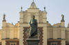 Poland - Krakow: Adamowi Mickiewiczowi statue and detail of faade of the Cloth Hall - photo by M.Gunselman