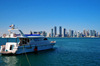 Doha, Qatar: yacht and West Bay skyline from the south side of Doha Bay - Doha skyscrapers - photo by M.Torres