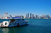 Doha, Qatar: yacht and West Bay skyline from the south side of Doha Bay - Doha skyscrapers - photo by M.Torres