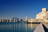Doha, Qatar: Museum of Islamic Art and the West Bay skyscrapers - photo by M.Torres