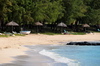 Pointe Coton beach, Rodrigues island, Mauritius: beach parasols and Casuarina trees - photo by M.Torres