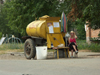 Russia - Udmurtia - Izhevsk: kvas tank - woman selling kvas -  for sale by the cupfull or bottle (photo by Paul Artus)