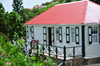 Windwardside, Saba: the museum - a typical Saban home, whitewashed with green-shuttered windows - displays the dwelling of a XIX century Dutch sea captain - photo by M.Torres