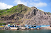 Fort Bay, Saba: harbour buildings and unstable rock slope - dive shops - photo by M.Torres