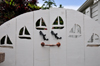 Windwardside, Saba: wooden gate with boats and lizards - Captain's Cottage - Wischusen Family - photo by M.Torres