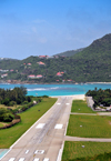 Plaine de la Tourmente, Saint Jean, St. Barts / Saint-Barthlemy: Gustaf III Airport seen from 'La Tourmente' hill, where the landing airplanes nearly touch the road before throwing themselves on the runway that finishes on the beach - photo by M.Torres