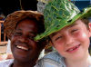 St Lucia: palm hats - people of the Western Indies - black man and white boy - photo by P.Baldwin