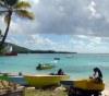 Mustique island / MQS (the Grenadines): boats rest on the beach (photographer: R.Ziff)