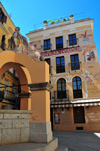 Iglesias / Igrsias, Carbonia-Iglesias province, Sardinia / Sardegna / Sardigna: fountain on Piazza A.Lamarmora, Fontana Su Maimoni and Palazzo covered in early 20th century mural ads - Palazzina Liberty - photo by M.Torres