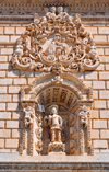 Sassari / Tthari, Sassari province, Sardinia / Sardegna / Sardigna: Cathedral of St. Nicholas of Bari - niche with St Gianuario killed in Porto Torres in the 4th century AD, one of the 'martiri turritani' - medallion with the Madonna del Bosco - faade detail - photo by M.Torres