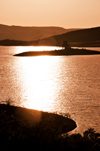 Orroli / Arrli municipality, Cagliari province, Sardinia / Sardegna / Sardigna: islet on the Mulargia dam - sun reflection - diga del Mulargia - Sarcidano sub-region - photo by M.Torres