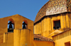Las Plassas / Is Pratzas, Medio Campidano province, Sardinia / Sardegna / Sardigna: Church of Santa Maria Maddalena - dome and its famous bronze bells - yellow against the blue sky - photo by M.Torres