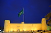 Riyadh, Saudi Arabia: Saudi flag and Al Masmak Fortress at night - Saudi Arabia's main historical location - photo by M.Torres