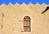 Al-Hofuf, Al-Ahsa Oasis, Eastern Province, Saudi Arabia: window and crenellated parapet at the Ibrahim Palace / Castle, a 16th century Ottoman fortress - UNESCO world heritage site - photo by M.Torres