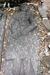 Scotland - Islay Island - Finlaggan: a memorial stone depicting a clansman decked out in highland armour - the stone is on display inside the ruins of the 14th century chapel - photo by C.McEachern