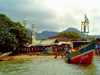 Tumbu, Western Area, Sierra Leone: colourful boat in the harbour - mosque in the background - photo by T.Trenchard
