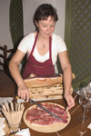 Slovenia - Preparing prosciutto for wine tasting in Vinoteka Brda in the Goriska Brda wine region - photo by I.Middleton
