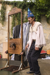 Slovenia - Kamnik Medieval Festival: magician preparing to chop off girl's head - photo by I.Middleton