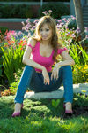 young Oriental woman in a glamorous fashion pose in a garden. Model is Malibu Stacy of Vancouver, BC, Canada,. Photographed at False Creek, Vancouver, BC, Canada. Model and property released. - photo by D.Smith