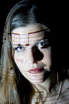 Close-up of young woman with music score and lyrics projected on her body. Model  released - photo by D.Smith