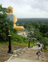 Dambulla, Sri Lanka: Golden Buddha, entrance to Dambulla Caves - path - photo by B.Cain