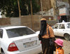 Sudan - Khartoum: veiled woman with child - Muslim lady - street scene - photo by L.Gewalli