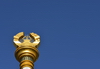 Dushanbe, Tajikistan: column bearing the Tajikistani national emblem / coat of arms - Soviet style frame with crown, sun and the Pamir mountains - photo by M.Torres