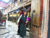 Tibet - Lhasa: temple gate and prayer wheels - photo by P.Artus