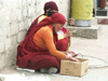 Tibet - Lhasa: street merchant - photo by P.Artus