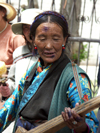 Tibet - Lhasa: street performer - musician - photo by P.Artus