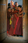 Tibet - childish novices on a door - photo by Y.Xu