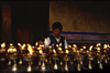 Tibet - lighting butter lamps - photo by Y.Xu